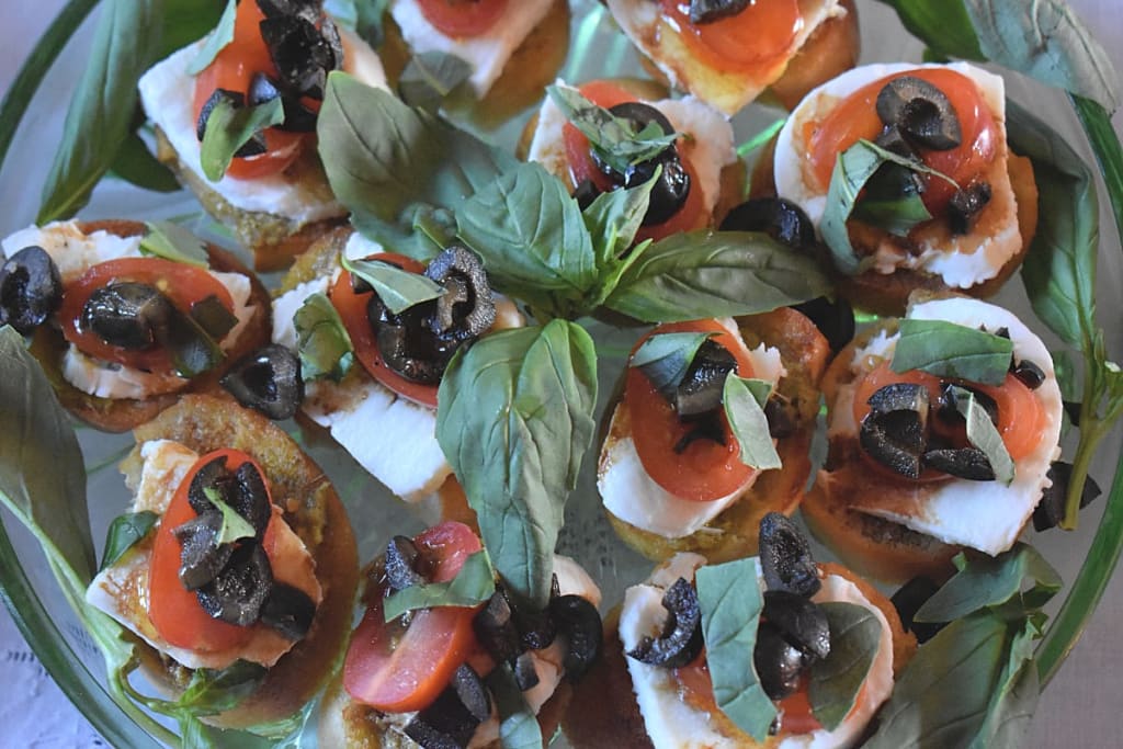 Mini Open Sandwiches with pesto, mozzarella Cheese, tomato and basil